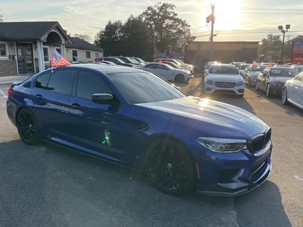 BMW M5 front three-quarter view, phone photo before CarShots